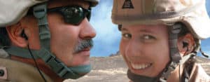 A man and a woman in military uniform wearing HearDefenders-DF®.