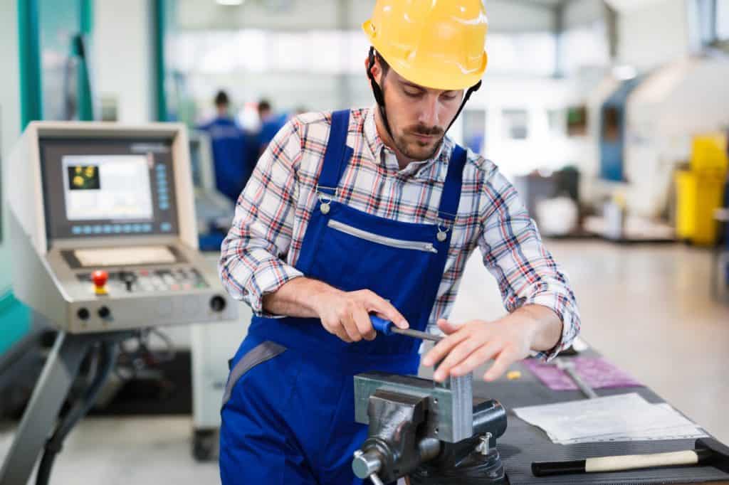 industrial factory employee working in metal manufacturing industry