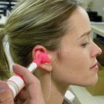 Woman having ear molds made