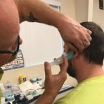 Man getting ear molds made for hearing protection