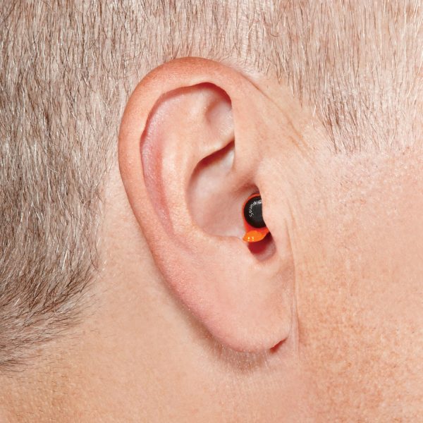View of small Soundgear Digital in-the-canal hearing aids pictured inside a man's ear